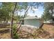 Backyard showcasing lush trees and a tranquil setting with a view of the house at 1890 15Th St, Orange City, FL 32763