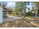 A backyard featuring a covered patio offers a serene and shaded outdoor living space at 1890 15Th St, Orange City, FL 32763