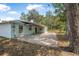 A spacious backyard features a covered patio and lush greenery, perfect for entertaining at 1890 15Th St, Orange City, FL 32763
