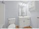 Cozy bathroom featuring a toilet, shower, and white vanity at 1890 15Th St, Orange City, FL 32763