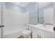 Bathroom featuring a shower over tub, toilet and vanity with mirror at 1890 15Th St, Orange City, FL 32763