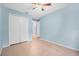 A serene bedroom boasts ample closet space, bathed in soft, natural light at 1890 15Th St, Orange City, FL 32763