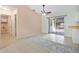 Dining area featuring tile flooring, neutral walls, ceiling fan, and access to both the kitchen and patio at 1890 15Th St, Orange City, FL 32763