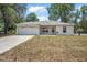 Charming single-story home with a well-maintained lawn and an attached two-car garage at 1890 15Th St, Orange City, FL 32763