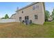 Backyard featuring a patio area and the exterior of the home at 1922 Cove Point Rd, Port Orange, FL 32128