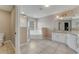 Bathroom with a tub, glass shower and double sink vanity at 1922 Cove Point Rd, Port Orange, FL 32128