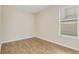 Bedroom with wood floors and a window with natural light at 1922 Cove Point Rd, Port Orange, FL 32128