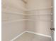 Walk-in closet with wire shelving and tile flooring for organized storage at 1922 Cove Point Rd, Port Orange, FL 32128