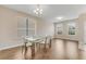 Contemporary dining room featuring a glass table with white chairs and lots of natural light at 1922 Cove Point Rd, Port Orange, FL 32128
