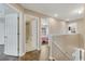 Hallway with tile and wood flooring that leads to bedrooms and a bathroom at 1922 Cove Point Rd, Port Orange, FL 32128