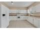 A modern kitchen featuring sleek white cabinets, granite countertops and stainless steel appliances at 1922 Cove Point Rd, Port Orange, FL 32128