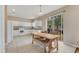Spacious kitchen featuring white cabinets and a center island with views to the backyard at 1922 Cove Point Rd, Port Orange, FL 32128