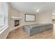 Inviting living room featuring a fireplace, media screen, wood floors and contemporary furniture at 1922 Cove Point Rd, Port Orange, FL 32128