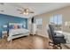 Main bedroom with a ceiling fan and hard wood floors at 1922 Cove Point Rd, Port Orange, FL 32128