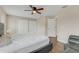 Main bedroom with ceiling fan, wood floors, and a large bed at 1922 Cove Point Rd, Port Orange, FL 32128