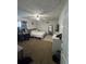 Bright bedroom with a bed, desk, and carpeted floors, offering comfort and functionality at 2219 Howland Blvd, Deltona, FL 32738