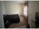 Modest bedroom with carpet, natural light from the window, and a simple bed at 2219 Howland Blvd, Deltona, FL 32738