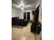 Comfortable bedroom with tiled floors, ceiling fan, and a dark-colored bed at 2219 Howland Blvd, Deltona, FL 32738