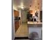 Well-lit kitchen with warm wooden cabinets, black countertops, and modern appliances at 2219 Howland Blvd, Deltona, FL 32738