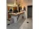 Kitchen with wood cabinets, breakfast bar, and modern lighting fixtures at 2219 Howland Blvd, Deltona, FL 32738