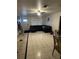 Spacious living room featuring tile flooring and a large sectional couch for relaxation and entertainment at 2219 Howland Blvd, Deltona, FL 32738