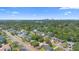 Sprawling neighborhood with lush greenery and stunning skyline views under a clear, blue sky at 2327 Mulbry Dr, Winter Park, FL 32789