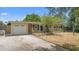 Charming single-story home featuring an attached garage and traditional design at 2327 Mulbry Dr, Winter Park, FL 32789