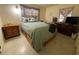 A comfortable bedroom with a cozy bed and natural light, creating a relaxing retreat at 2332 Hadley St, Deltona, FL 32738