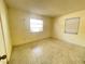 Bedroom with speckled flooring and dual windows at 2332 Hadley St, Deltona, FL 32738