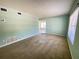 Spacious living room with carpet flooring and bright natural light at 2332 Hadley St, Deltona, FL 32738