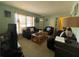 A cozy living room filled with plush furniture, creating an inviting space for relaxation at 2332 Hadley St, Deltona, FL 32738