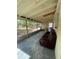 Enjoy the fresh air on this screened porch with a comfortable sofa and plenty of room for activities at 2332 Hadley St, Deltona, FL 32738