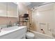 Cozy bathroom with a shower-tub combo, updated vanity, and neutral tile at 2416 Candlewick St, Deltona, FL 32738