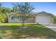 Charming single Gathering home featuring a brick facade, neutral colors, and a well maintained front yard at 2416 Candlewick St, Deltona, FL 32738