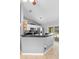 Modern kitchen with gray walls, a breakfast bar, stainless steel appliances and sliding doors to the pool at 2416 Candlewick St, Deltona, FL 32738