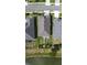 A beautiful aerial view of the home, showcasing the well-manicured lawn and a tranquil lake in the backyard at 2435 Pawtucket Pass, Mount Dora, FL 32757