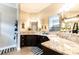 Spacious bathroom with granite countertops and dual sinks at 2435 Pawtucket Pass, Mount Dora, FL 32757