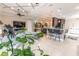 Open living room with tile floors, coffered ceiling, and modern furnishings at 2435 Pawtucket Pass, Mount Dora, FL 32757