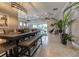 Open-concept living space with dining area, coffered ceiling, and sliding glass doors at 2435 Pawtucket Pass, Mount Dora, FL 32757