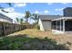 Expansive backyard view with a pool, patio, and ample green space at 245 Rosita Dr, Debary, FL 32713