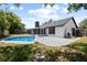 Exterior of home featuring a screened patio and a sparkling swimming pool at 245 Rosita Dr, Debary, FL 32713