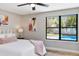 Light bedroom with wood floors and a view of the pool at 245 Rosita Dr, Debary, FL 32713