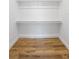 Empty walk in closet featuring shelving and wood floors at 245 Rosita Dr, Debary, FL 32713
