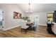 Cozy dining room with wood floors, modern lighting, and access to the backyard at 245 Rosita Dr, Debary, FL 32713