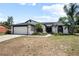 Beautifully landscaped home exterior with a well-manicured front yard at 245 Rosita Dr, Debary, FL 32713