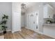 Inviting foyer with hardwood flooring and a view of the kitchen and living areas at 245 Rosita Dr, Debary, FL 32713