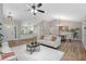 Open-concept living and dining area with hardwood floors and a modern design at 245 Rosita Dr, Debary, FL 32713