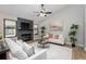 Cozy living room featuring a fireplace, vaulted ceilings, and hardwood flooring at 245 Rosita Dr, Debary, FL 32713