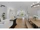 Open-concept living and dining area with hardwood floors and a modern design at 245 Rosita Dr, Debary, FL 32713