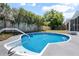 Backyard pool featuring light blue tile, concrete surround, and a privacy fence at 245 Rosita Dr, Debary, FL 32713